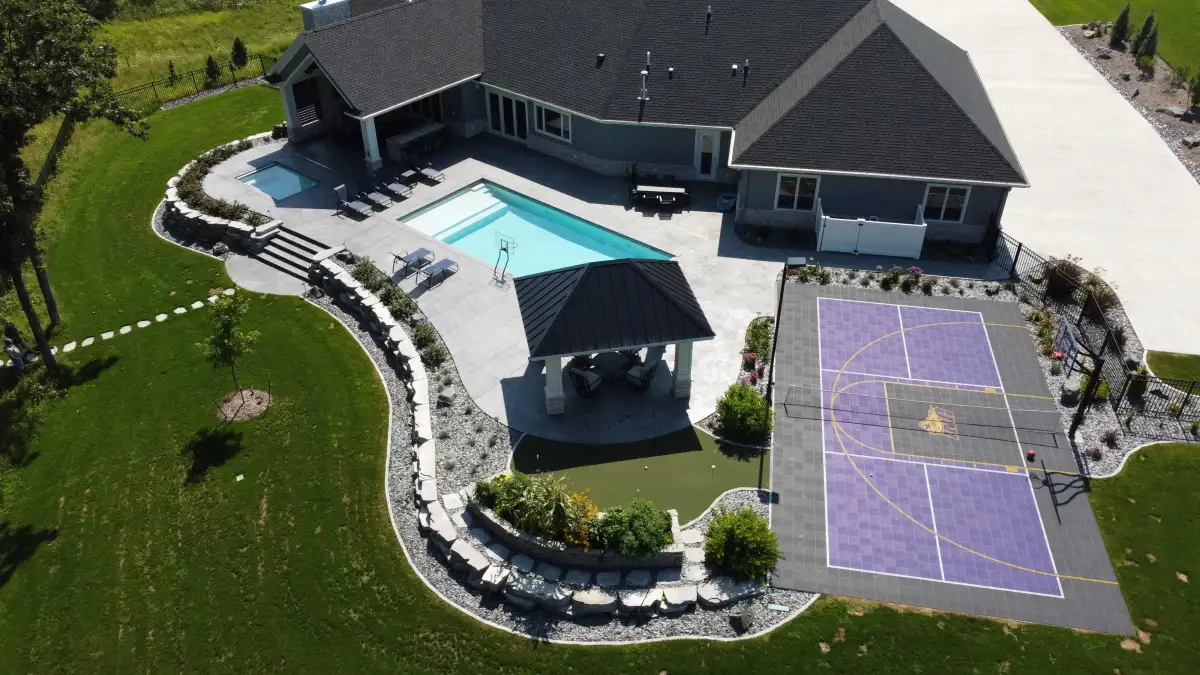 Aerial view of completed landscape design with patio and plantings