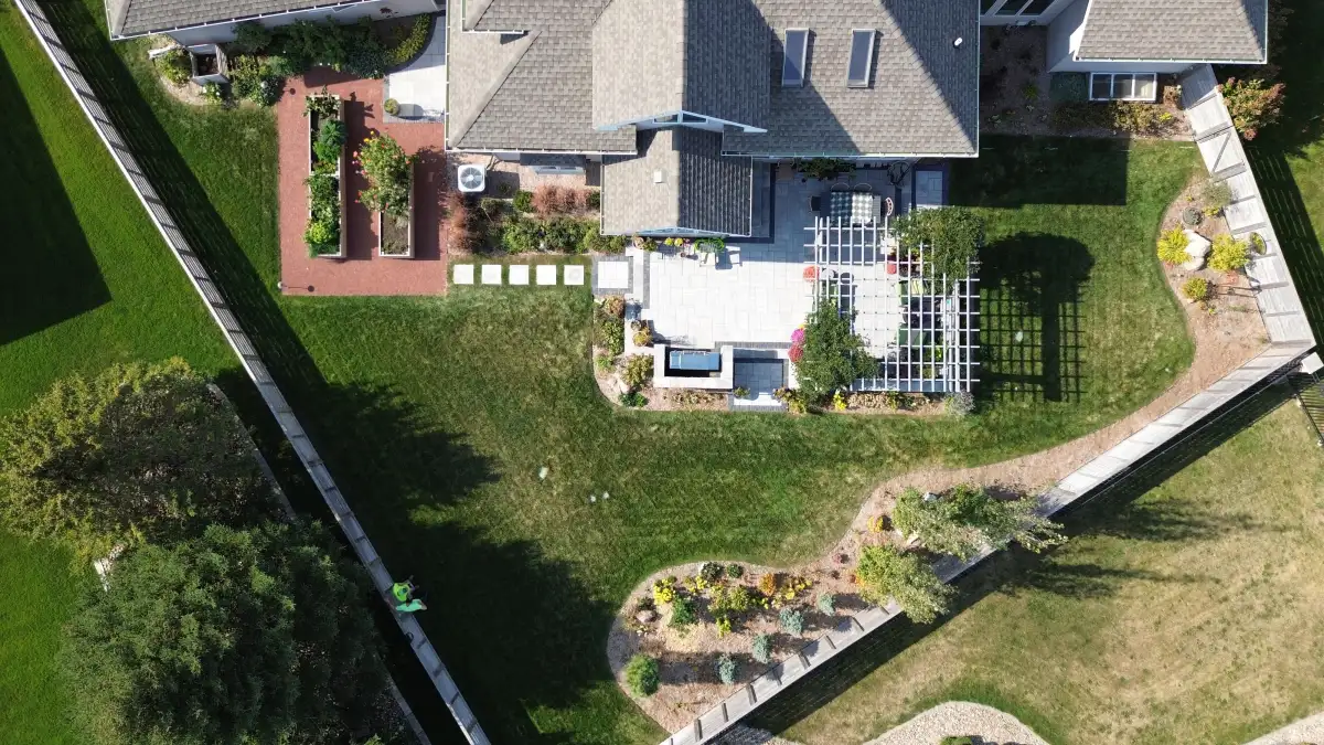 Aerial drone shot of a custom patio project by Matthias Landscaping in the Cedar Valley