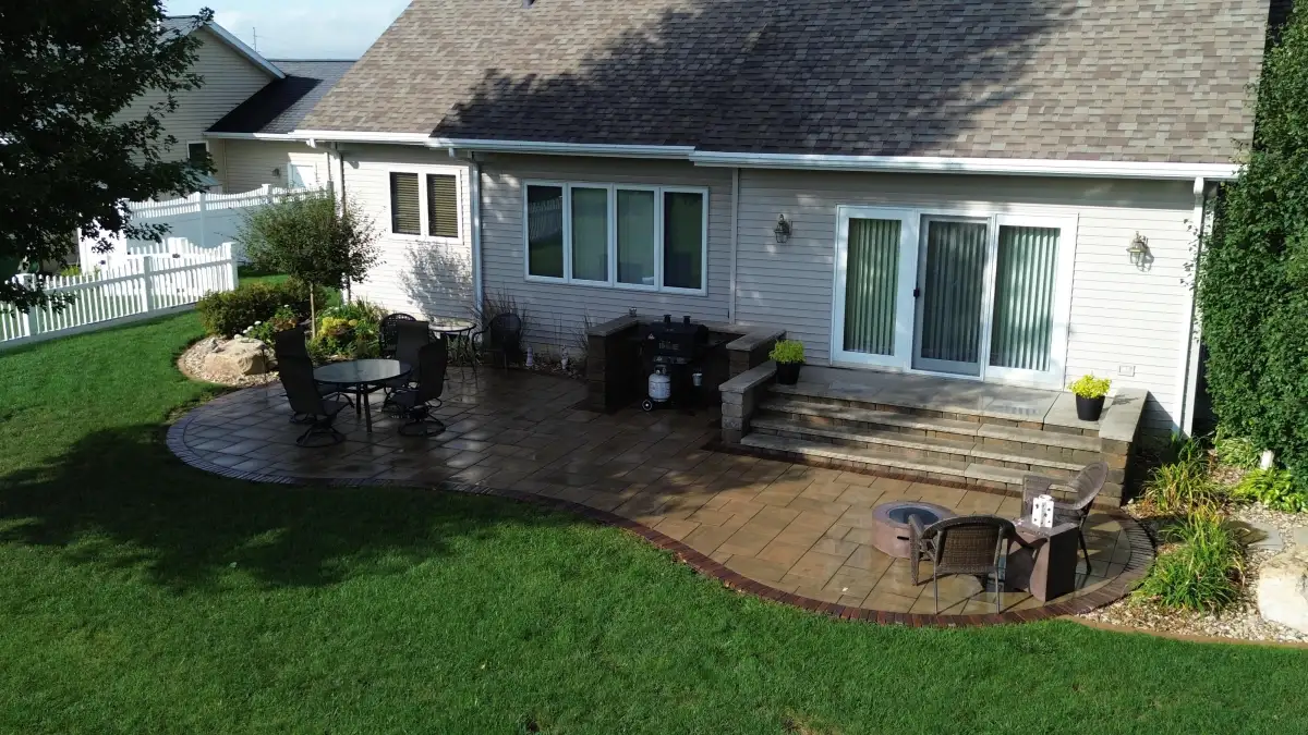 Multi-tiered stamped patio with fire pit and grill station