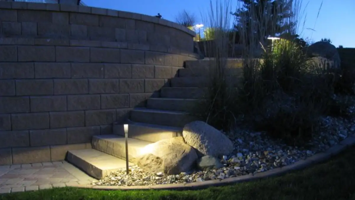 Landscape lighting illuminating patio area in Waterloo, Iowa