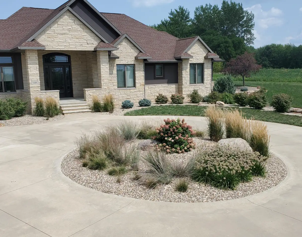 Residential landscaping with fresh plantings in Waterloo, Iowa