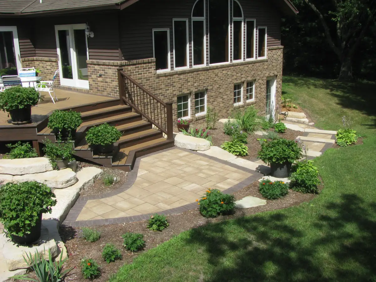 Mulched garden beds with hostas and ornamental plantings