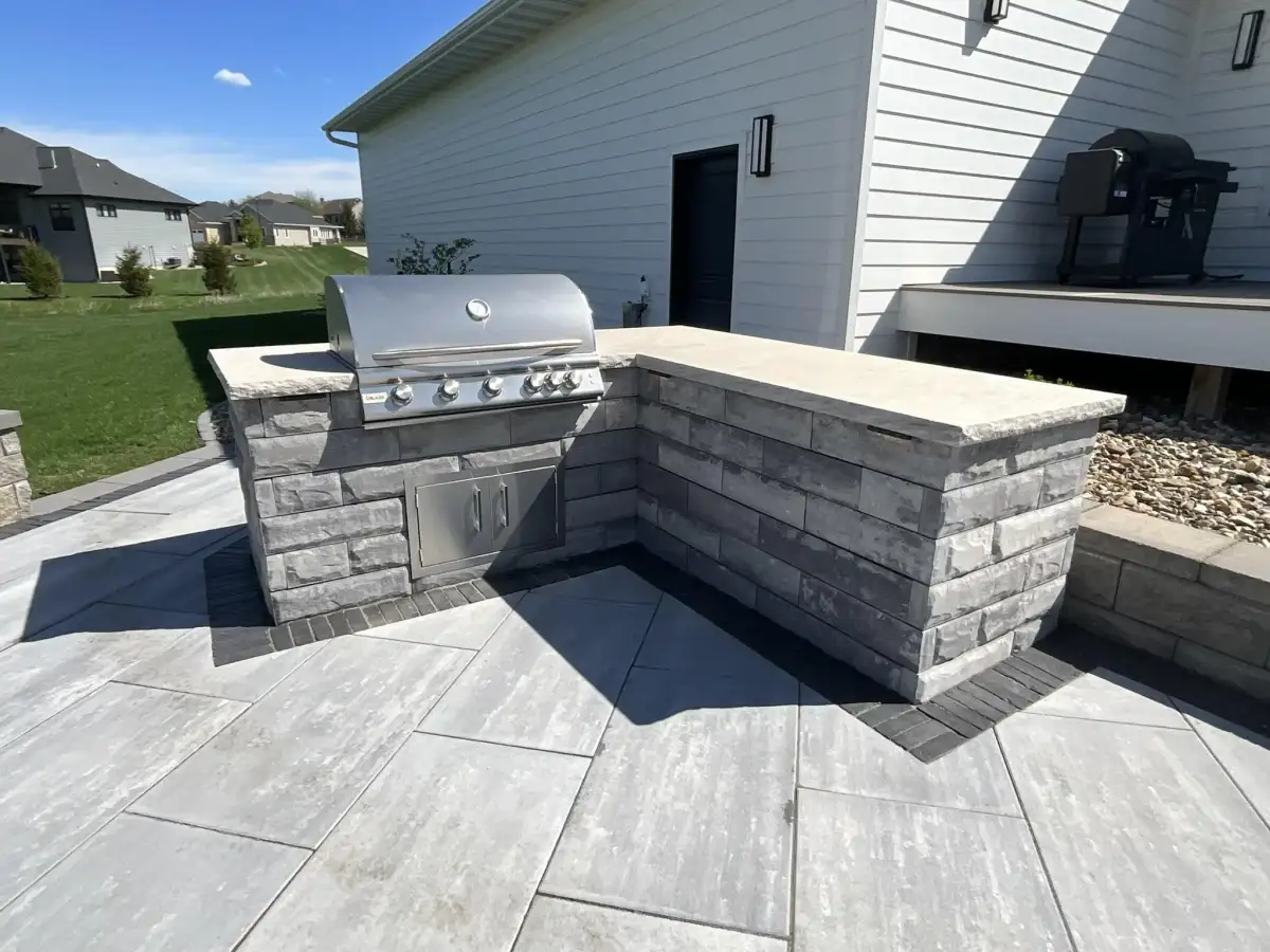 Built-in outdoor grill station with stone countertop in Waterloo Iowa