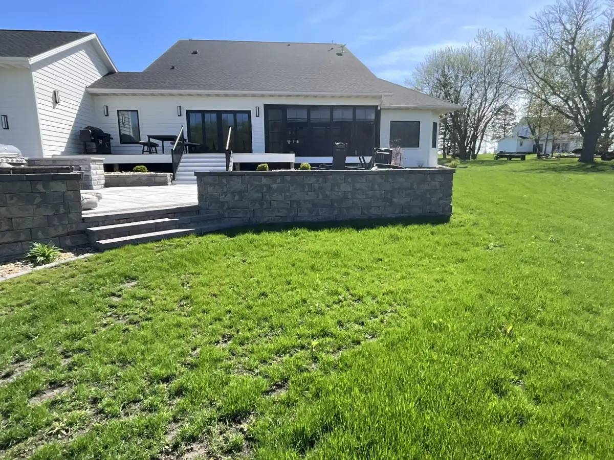 Custom fire pit surrounded by paver patio in Cedar Falls Iowa