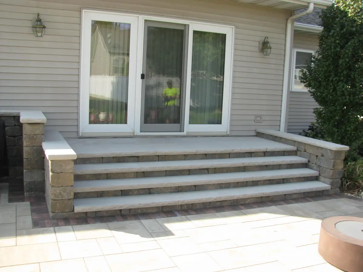 Completed patio and outdoor living space with landscaping in Waterloo Iowa
