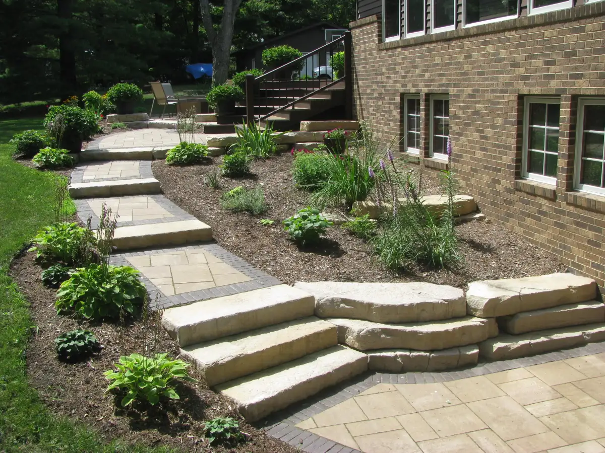 Stone retaining wall with built-in steps in the Cedar Valley