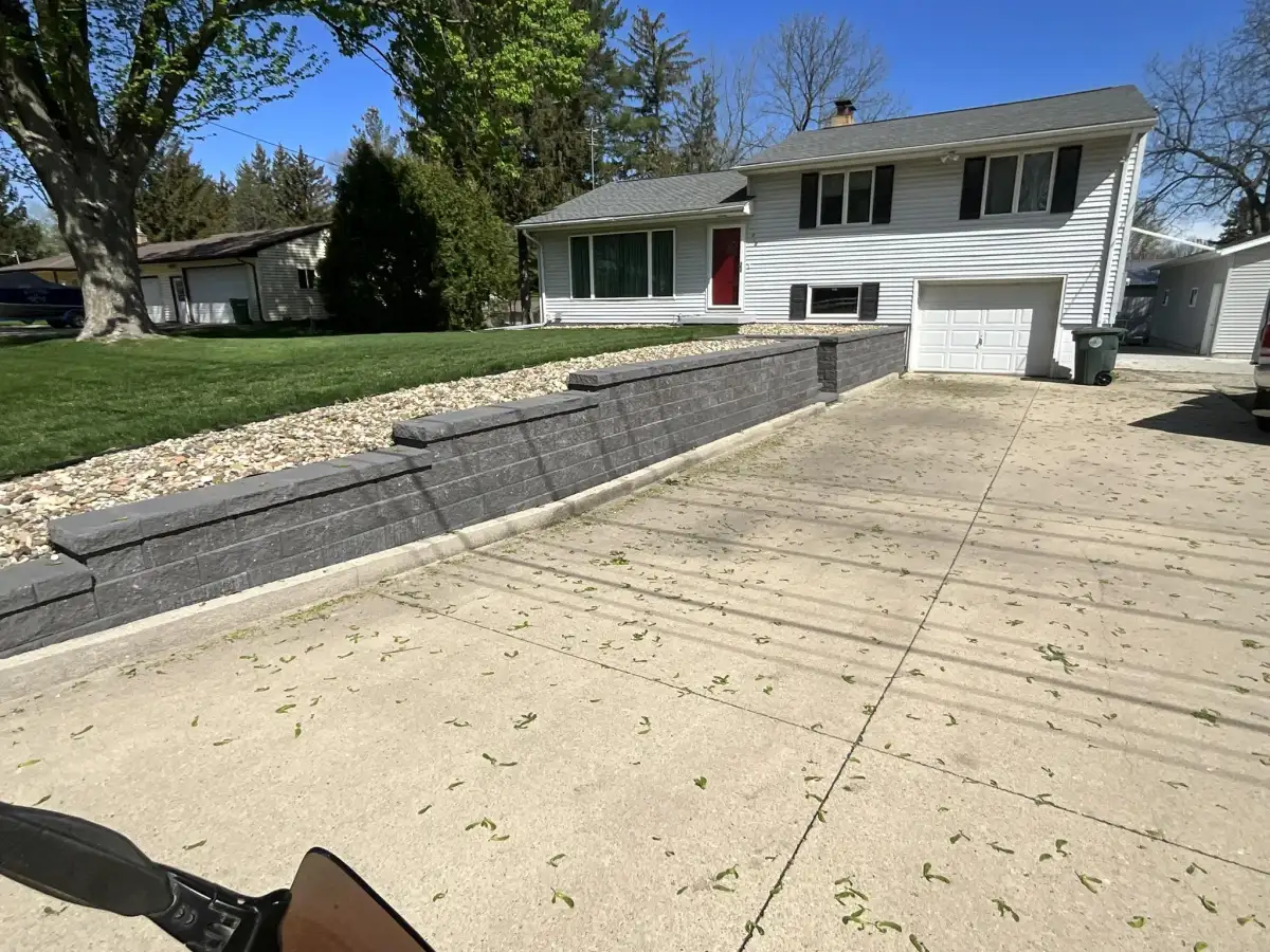 Block retaining wall along property grade in Iowa